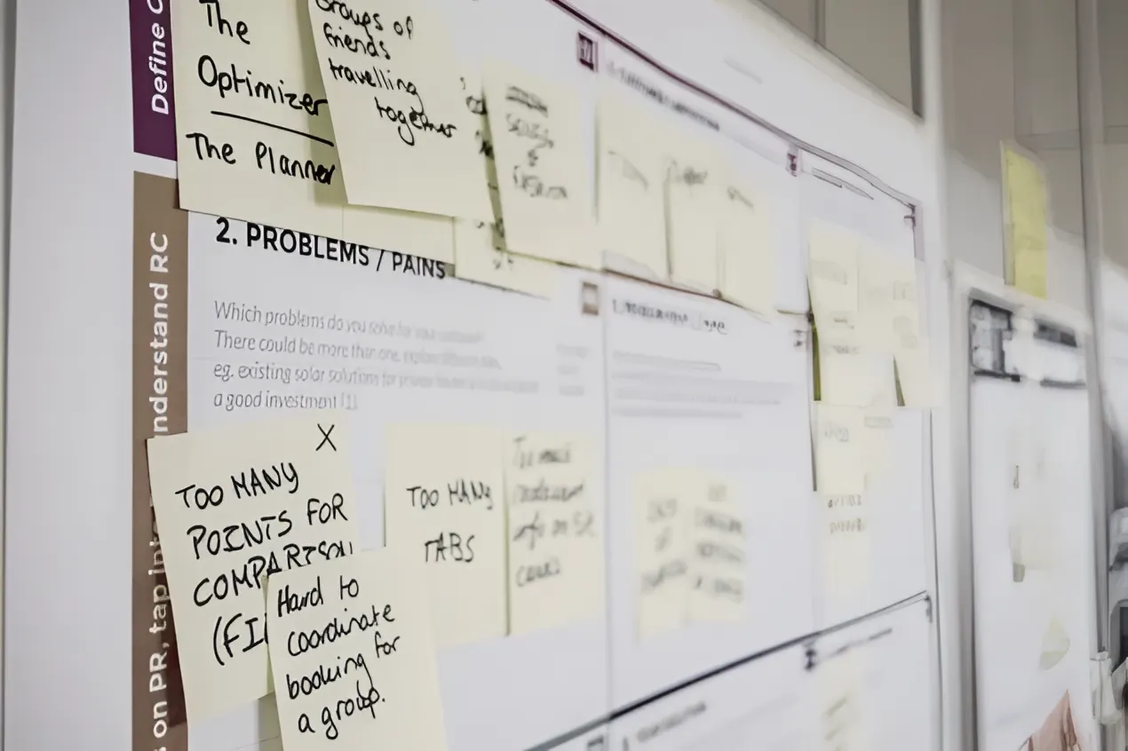 Planning wall covered in sticky notes from a working session